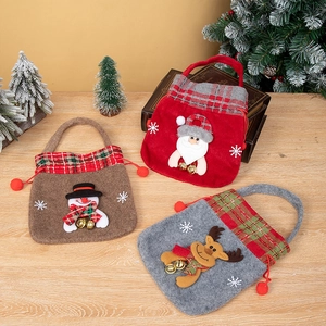 Three Christmas gift bags with Santa, Snowman, and Reindeer 3D designs and bells