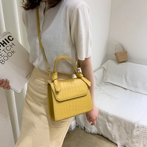 Elegant yellow crocodile embossed leather handbag with crossbody strap in French style