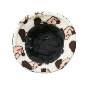 Detailed interior of plush bucket hat showing brown animal print and premium stitching