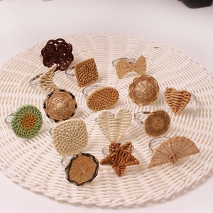Handwoven rattan napkin rings in heart and star shapes with durable metal ring base