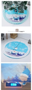 Detail of blue plush Christmas tree skirt with snowman pattern and faux fur trim
