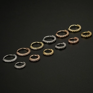 20G copper hoop earrings and nose rings set with zircon in gold, silver, and rose gold
