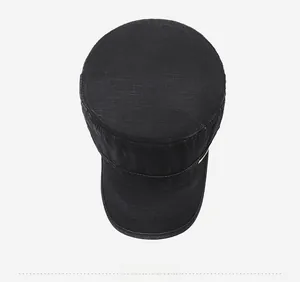 Top down view of black flat top cadet cap showing cotton canvas texture and round crown