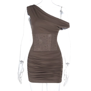 Detail of dark brown bodycon dress featuring delicate lace waist patchwork and ruched fabric