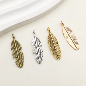 Feather-shaped antique alloy pendants in bronze silver gold and rose gold colors