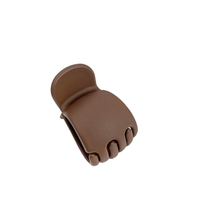 Matte brown shark hair claw clip for high ponytail styling on a white background