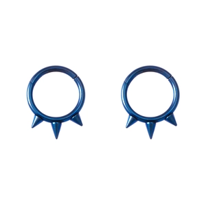 Close-up of blue circular nose rings with three punk spikes made of anodized metal