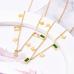 Elegant gold butterfly necklace with rectangular emerald and clear zircon pendants