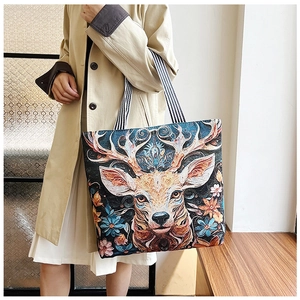 Detail of colorful ethnic tote bag featuring 3D deer and flower embroidery art