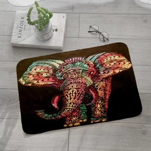 Detail view of colorful mandala elephant pattern on flannel rug over grey wooden floor