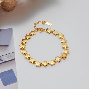 Detail of 18K gold-plated stainless steel bracelet featuring 3D star-shaped links
