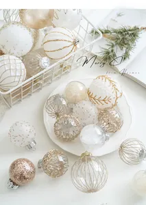 Detail of elegant champagne and white Christmas ornaments with glitter and stripes