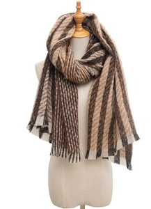 Detail of striped brown knit scarf showing thick herringbone texture and fringe edges