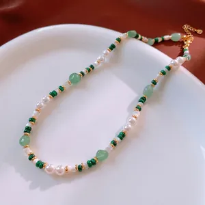 Elegant natural stone and pearl beaded necklace with green beads and gold accents