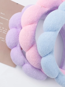 Close-up of fluffy pastel spa headbands in soft microfiber with thick bubble texture