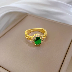 Adjustable gold plated watchband ring with oval emerald stone and zircon accents