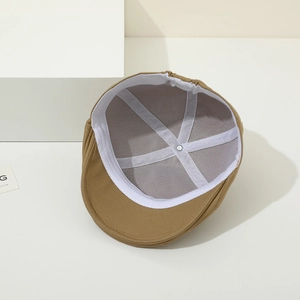 Close-up of baby beret with breathable mesh lining and adjustable elastic band