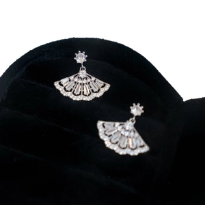 Elegant fan-shaped silver earrings with sparkling zircon crystals in a velvet jewelry box