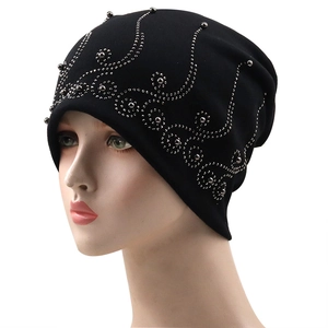 Black double-layer cotton beanie with silver metal stud vine pattern on white background