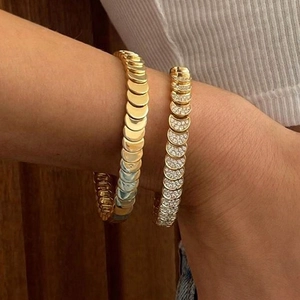 Polished gold crescent moon stacked bracelets with sparkling white cubic zirconia