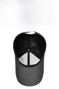 Detail view of the breathable mesh lining and adjustable strap on a grey baseball cap