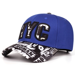 Detail of NYC patch embroidery and graffiti print on a flat brim hip-hop snapback hat