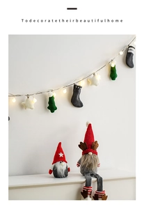 Cozy Christmas gnomes with warm LED string lights for festive home holiday wall decoration