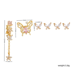 Detail view of 6-piece gold butterfly earring set with size dimensions and pink zircon