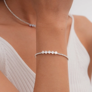 Detailed view of luxury zircon tennis bracelet on wrist part of a jewelry set