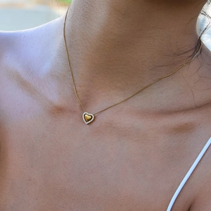 Elegant 18K gold stainless steel heart pendant necklace with rhinestones on model
