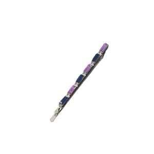 Close-up of hair clip with rectangle blue and purple rhinestones on silver metal base