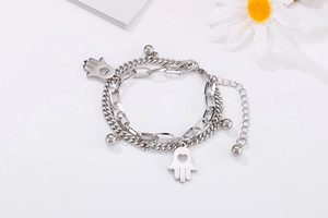 Detail of silver double-layer Hamsa hand bracelet with beads and lobster clasp