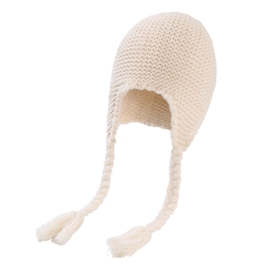 Detailed view of off-white chunky knit texture and braided tassels on baby winter hat