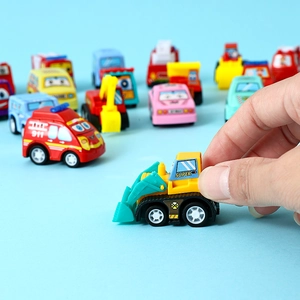 Close-up of a hand holding a yellow toy bulldozer from a colorful 6-piece car set