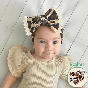 Soft leopard print baby headband with bow and lace trim, stylish infant hair accessory