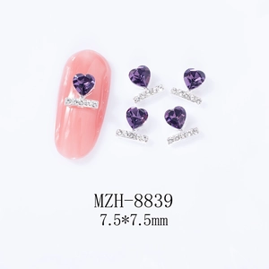Detail view of purple heart nail rhinestones with silver base and dimensions 7.5x7.5mm