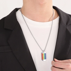 Minimalist stainless steel rainbow military tag necklace worn by a model in casual attire