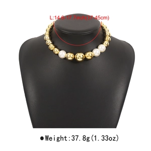 Detail showing oversized gold beads and white pearls choker with length measurements