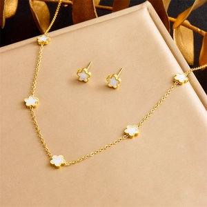 Gold-plated titanium steel jewelry set featuring white mother-of-pearl five-leaf flowers