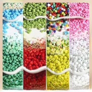 Detailed macro view of 2/3/4mm solid color glass seed beads for DIY jewelry making