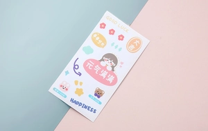 Close-up of cute cartoon stickers with bears, rabbits and positive text for DIY bottles