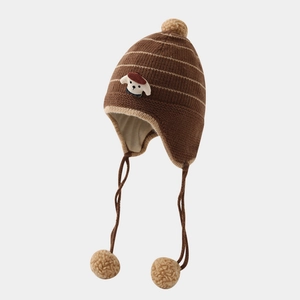 Close-up of thick knitted winter hat showing puppy patch and soft striped texture