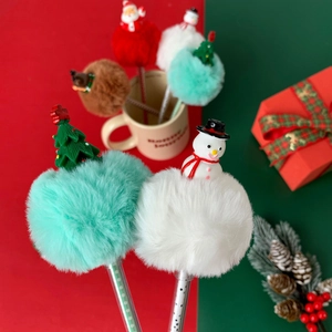 Christmas ballpoint pens with fluffy pom-poms and cartoon Santa, reindeer, and snowman dolls
