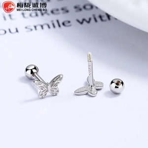 Macro shot of 925 sterling silver bow earrings with screw backs and matte texture