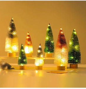 Detail of colorful mini light-up Christmas trees with warm LED lights and wooden bases