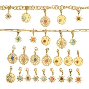 Detail of sun-themed gold necklaces and colorful stone pendants on white background