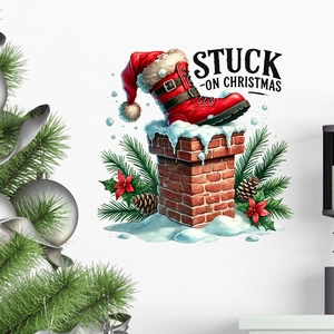 Detail of Christmas wall sticker with red boots stuck in a brick chimney and pine cones