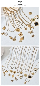 Detail showing assorted gold pendant designs including hearts, butterflies and moon shapes
