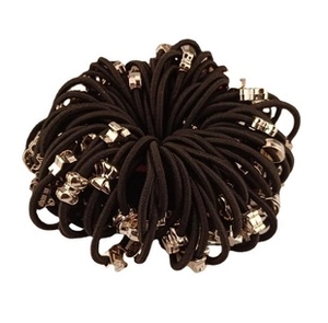 Close-up of black elastic hair bands with silver butterfly and star charms