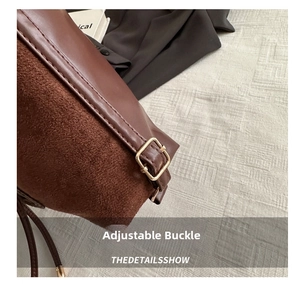 Detail of dark brown tote bag showing gold metal buckle and premium mixed textures